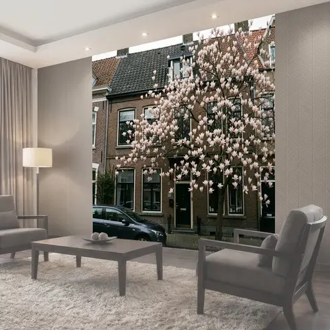 Фотообои Цветущее дерево у кирпичного дома