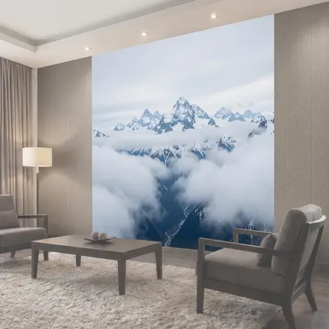 Фотообои Заснеженные горные вершины в облаках
