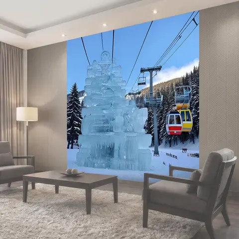 Фотообои Зимний день на горнолыжном курорте с ледяными скульптурами и красочными канатными дорогами, полными лыжников